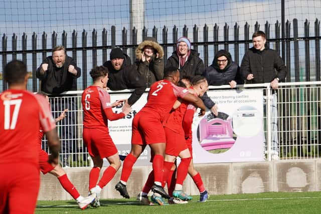 Melton celebrate Kairo Edwards-John's equaliser against Loughborough. Photo: Mark Woolterton.