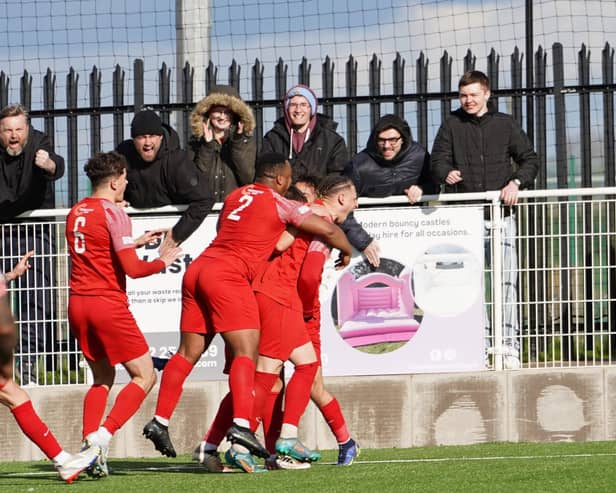 Melton celebrate Kairo Edwards-John's equaliser against Loughborough. Photo: Mark Woolterton.
