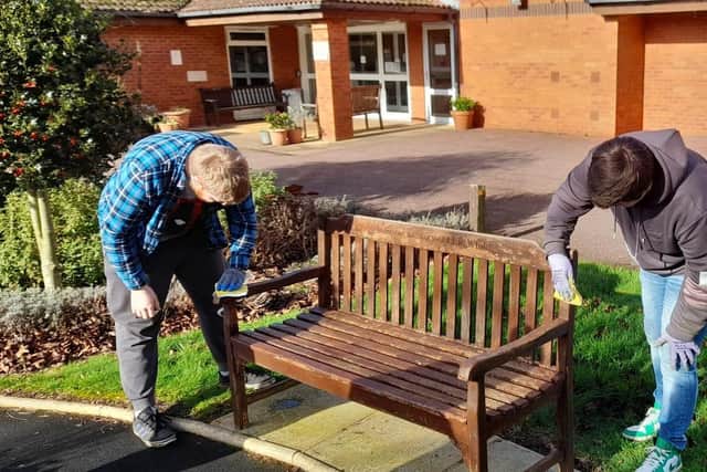 Young people working on seating at Gretton Court retirement complex in Melton