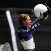 Amelia Coltman reacts to the crowd after heat two at Cortina.