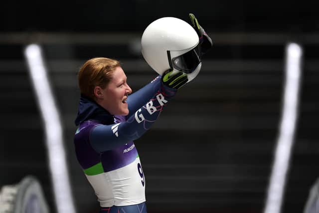 Amelia Coltman reacts to the crowd after heat two at Cortina.