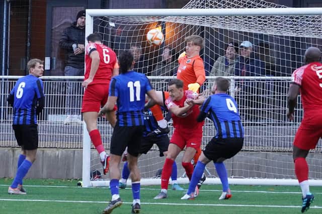 Sam Beaver heads home Melton's fourth goal on Saturday. Photo by Mark Woolterton.