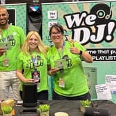 Ross and Faye Spencer (centre) showcase their new board game at the UK Games Expo