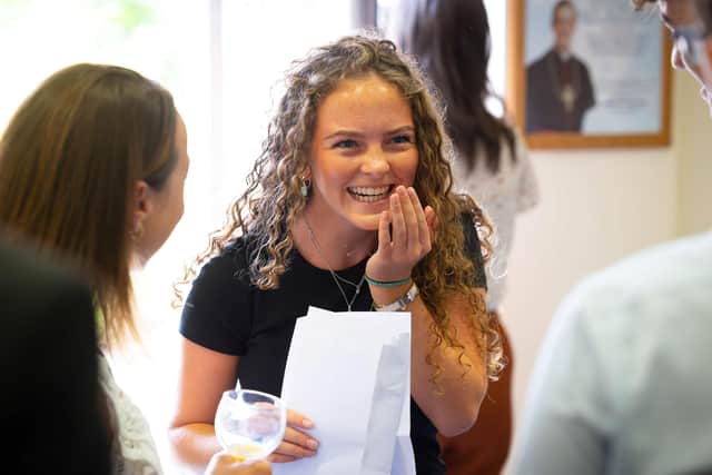 Students react to receiving their GCSE results at Ratcliffe College on Thursday