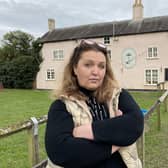 Landlady Jo Towle outside the Crown and Plough at Long Clawson, which is closed after regular flooding