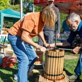 Volunteers work one of the presses to make apple juice at Melton Apple Day PHOTO Estelle Slegers Helsen