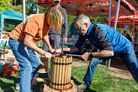 Volunteers work one of the presses to make apple juice at Melton Apple Day PHOTO Estelle Slegers Helsen