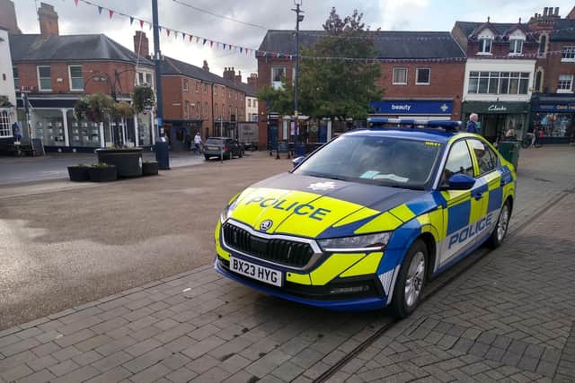 A police car parked in Market Place, Melton