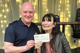 Stu McCarthy, chairman of the Melton Trumpton Committee, presenting Christine Slomkowska with a cheque