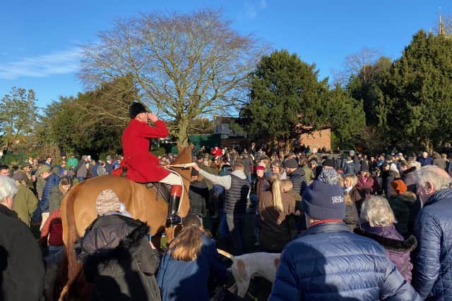 Riders drink from the stirrup cup as hundreds gather for the traditional Melton Mowbray New Year hunt meet