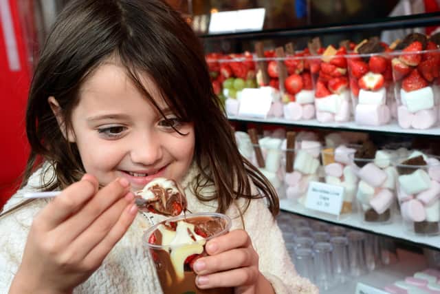 A little girl enjoys a treat at a previous ChocFest in Melton