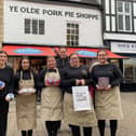 Manager Richard Griffiths with staff members outside the Dickinson and Morris Ye Olde Pork Pie Shoppe