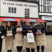 Manager Richard Griffiths with staff members outside the Dickinson and Morris Ye Olde Pork Pie Shoppe