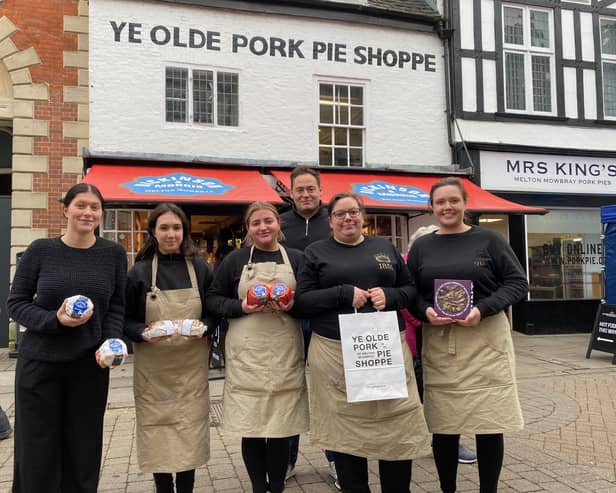 Manager Richard Griffiths with staff members outside the Dickinson and Morris Ye Olde Pork Pie Shoppe