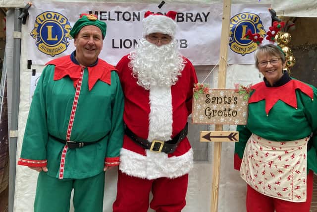 Santa and his elves outside Melton Lions Club's grotto in the Bell Centre