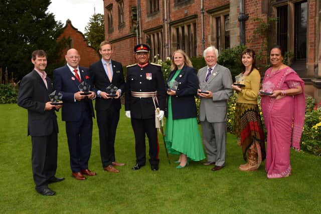 Lord-Lieutenant of Leicestershire, Mike Kapur, with the Coronation Champions at the ceremony, from left - Bob Lee, Bob White, Adam Jones, Helen Crouch, Geoffrey Kirk, Kimberley Durham and Jasu Tailor