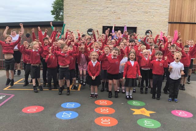 Waltham Primary School pupils celebrate their school's rating of 'good' in the latest Ofsted inspection
