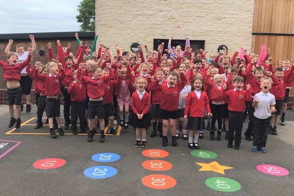 Waltham Primary School pupils celebrate their school's rating of 'good' in the latest Ofsted inspection