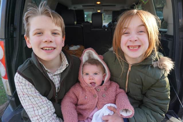 Harriet Fryer (centre) with brother Isaac and sister Olivia