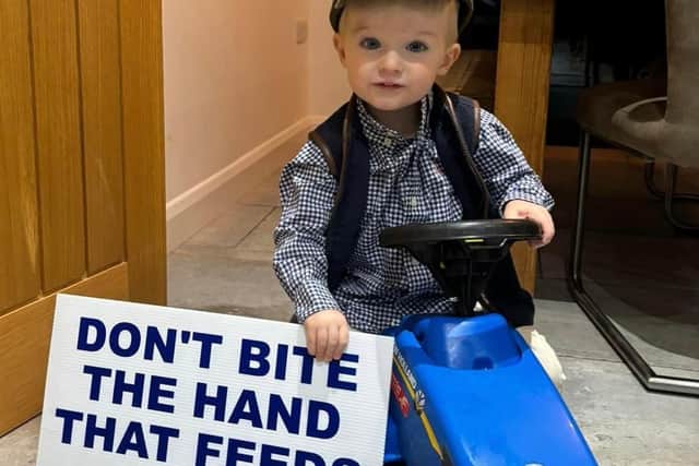 A child of a local farming family pictured before the local protestors headed to London
