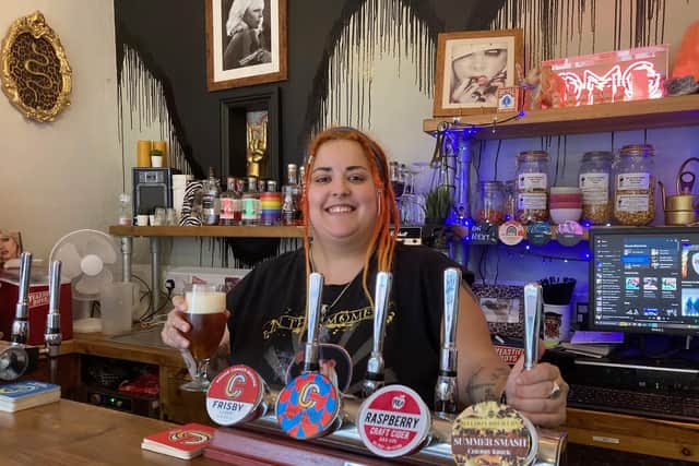 Charlie Donovan serving at her Charlie's Bar in King Street