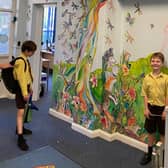 Pupils check out the new mural at St Francis Primary School in Melton
