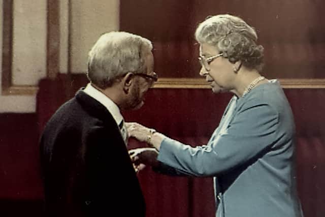 John Horn is presented with his OBE by HM The Queen in 1994