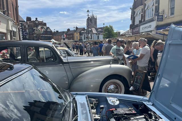 Some of the classic cars are admired during a previous vintage craft market in Melton