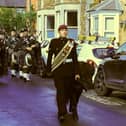 Lt Cpl Richards with Pegasus & Seaforth Highlanders Pipe Band leading the Parade along High St, Somerby, at the weekend IMAGE Melanie Davies