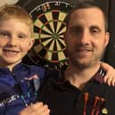 Talented schoolboy darts player Jake Moore (8) with his proud dad Shane