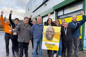 Some of the staff and volunteers at The Hanger charity shop which has raised £1M for the air ambulance for the second year running