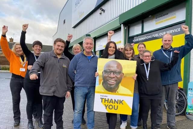 Some of the staff and volunteers at The Hanger charity shop which has raised £1M for the air ambulance for the second year running