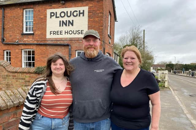 Landlord Chris Dyson and award-winning piemakers Tara and Shannon Eades outside The Plough Inn at Hickling