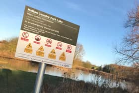 A warning sign about the dangers of swimming at Melton Country Park