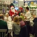 Santa Claus arrives at the Re-engage Christmas party at The Welcome Cafe at Twyford
