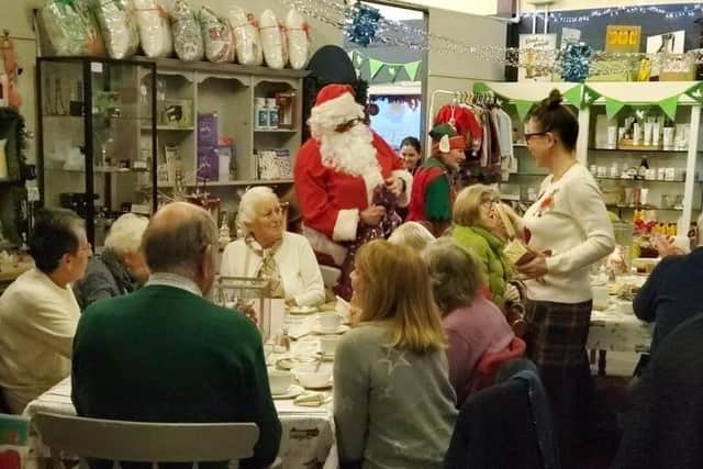 Santa Claus arrives at the Re-engage Christmas party at The Welcome Cafe at Twyford