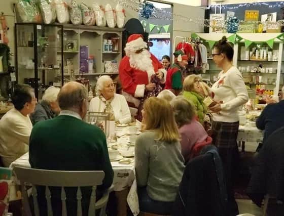 Santa Claus arrives at the Re-engage Christmas party at The Welcome Cafe at Twyford