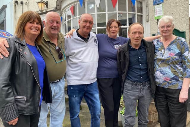 Landlady Sharon Brown and her mum June with some of their regulars at The Grapes in Melton
