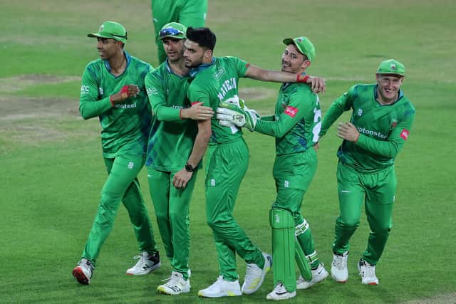 Naveen-ul-Haq of Leicestershire Foxes is mobbed by team mates after taking the wicket of Dane Paterson to win the Vitality T20 Blast match between Nottinghamshire Outlaws and Leicestershire Foxes at Trent Bridge. (Photo by David Rogers/Getty Images)