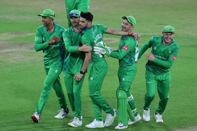 Naveen-ul-Haq of Leicestershire Foxes is mobbed by team mates after taking the wicket of Dane Paterson to win the Vitality T20 Blast match between Nottinghamshire Outlaws and Leicestershire Foxes at Trent Bridge. (Photo by David Rogers/Getty Images)
