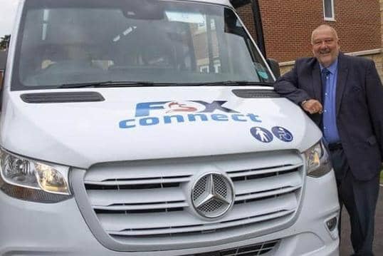Councillor Ozzy O'Shea with one of the new on-demand buses set to carry passengers to and from rural areas
