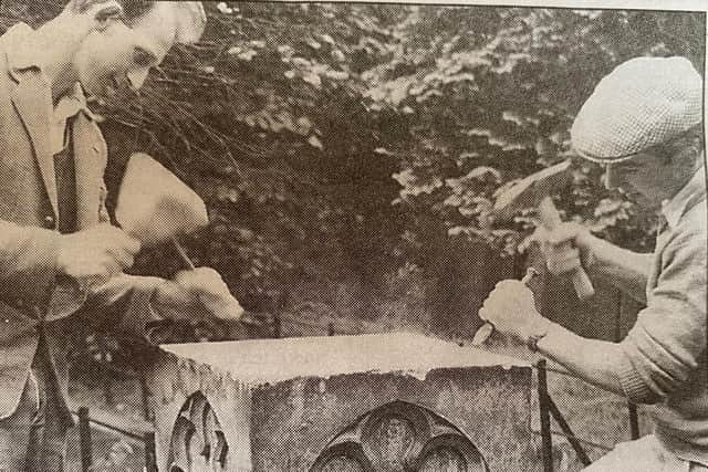 Stephen Herbert (right) and Bob Jaggard working on a memorial stone in Melton churchyard