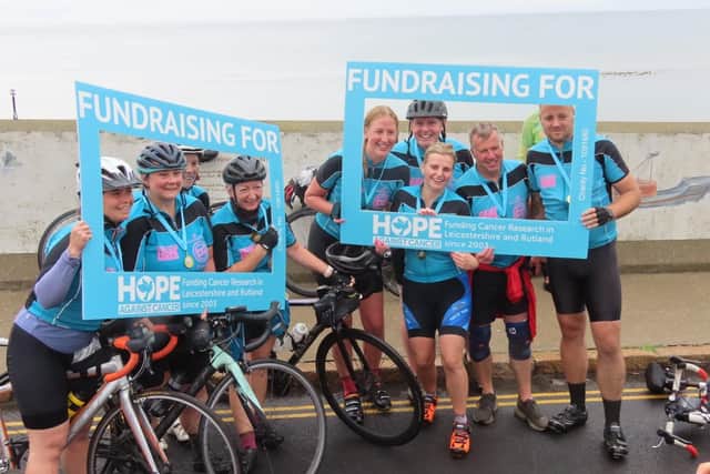 Alice Greaves with some of her team who raised £85K for cancer research with a 125-mile cycling fundraiser