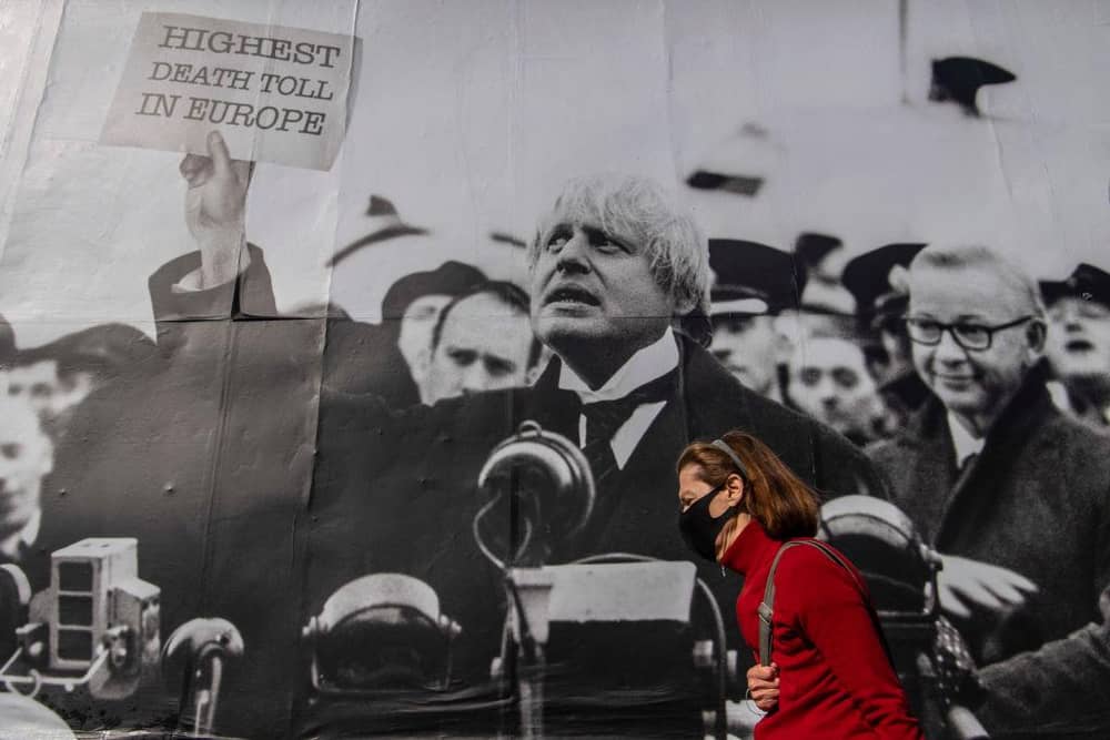 A satirical poster from the group Led By Donkeys depicting Boris Johnson as former British prime minister Neville Chamberlain delivering his “Peace for Our Time” speech in Kentish Town, London (Photo: Justin Setterfield/Getty Images)