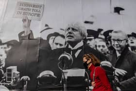 A satirical poster from the group Led By Donkeys depicting Boris Johnson as former British prime minister Neville Chamberlain delivering his “Peace for Our Time” speech in Kentish Town, London (Photo: Justin Setterfield/Getty Images)