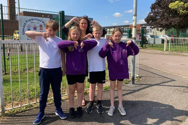 Sherard Primary School headteacher Helena Blumfield with pupils Thomas, Bea, Orla and Joe at one of the locations where parents have been parking dangerously