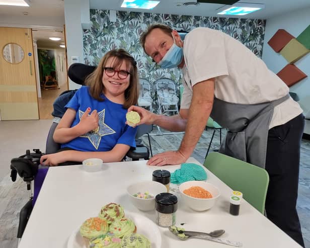 Erin decorates some cakes for her mum at Rainbows Hospice, which is preparing for its Open Day