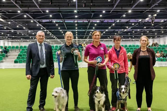 Lindsay Furze with Bowie (on the left of the three dog owners) celebrate at the big Kennel Club agility contest