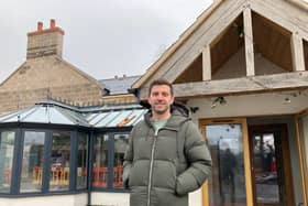 Harry Gurney pictured outside the Tap and Run as the rebuild job continues this week