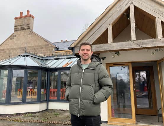 Harry Gurney pictured outside the Tap and Run as the rebuild job continues this week